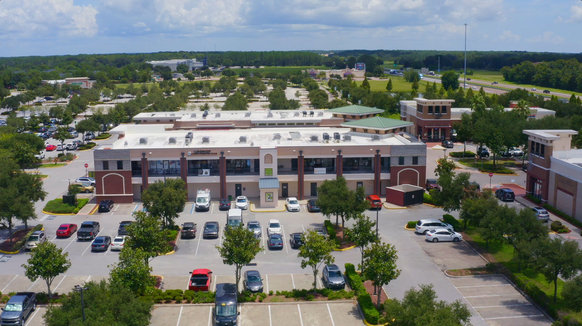 background: aerial image of buildings in business center