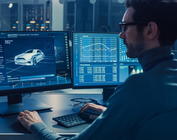 person working at computer screen small