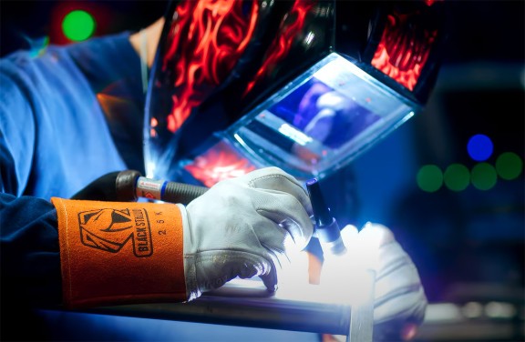 welder working on small equipment small